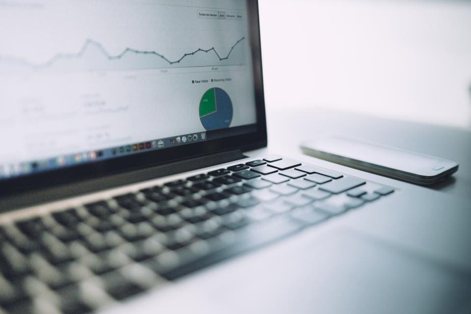 A laptop showing an analytics dashboard